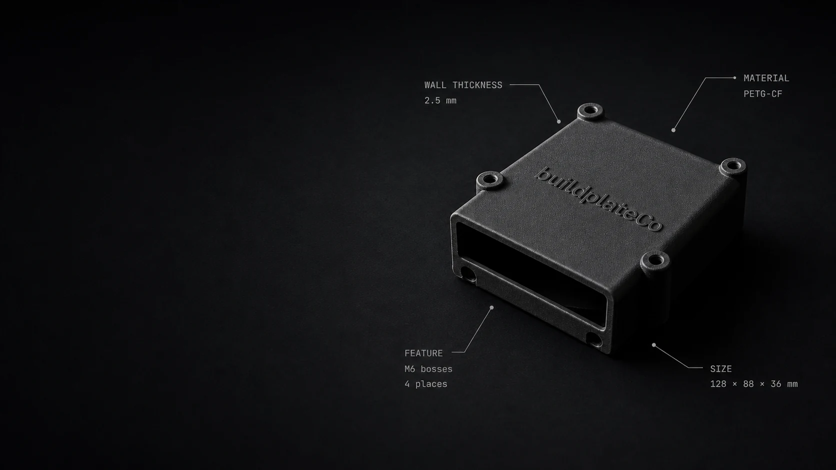 Matte black BuildplateCo electronics enclosure labeled with PETG-CF material, wall thickness, mounting bosses, and overall size